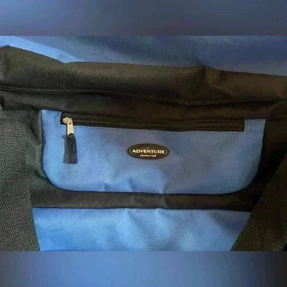 Adventure brand cargo travel‎ bag 30”L with several zipper pockets and wheels